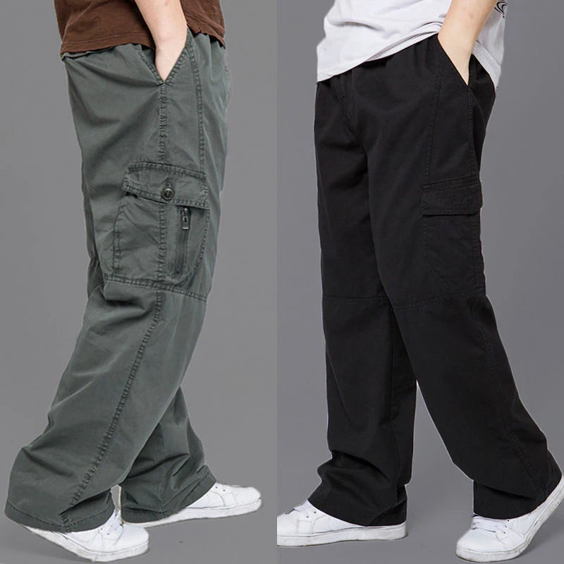 Two pairs of cargo pants, one gray and one black, worn by models on a gray background.