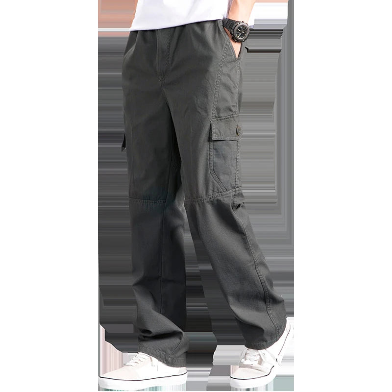 Dark gray cargo pants worn by a person on a white background