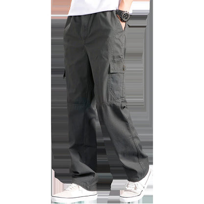 Dark gray cargo pants worn by a person on a white background
