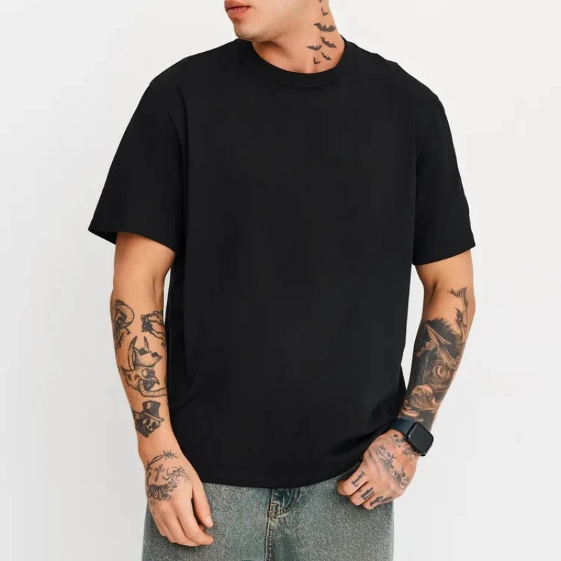 Person wearing a black t-shirt on a white background