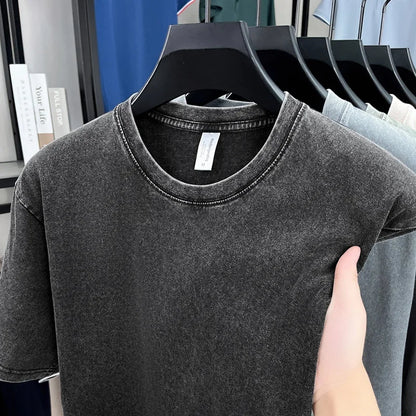 Gray t-shirt on a hanger with a blurred background