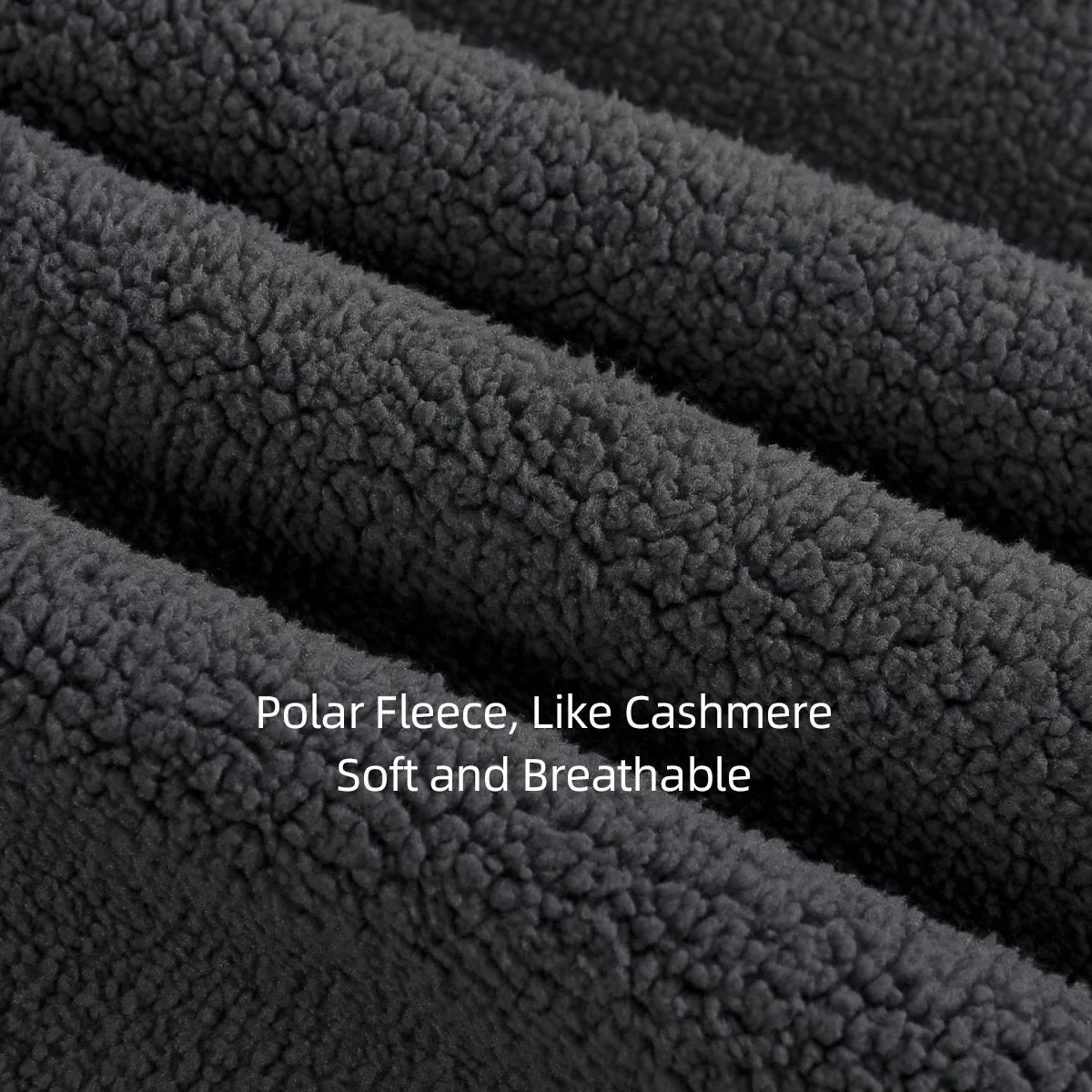 Close-up of dark gray polar fleece fabric with text 'Polar Fleece, Like Cashmere Soft and Breathable'.