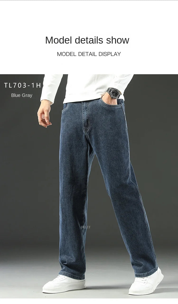 Person wearing blue jeans and a white shirt on a gray background
