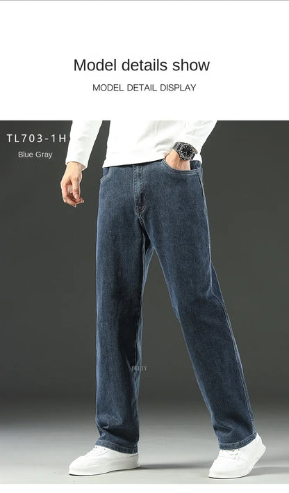 Person wearing blue jeans and a white shirt on a gray background