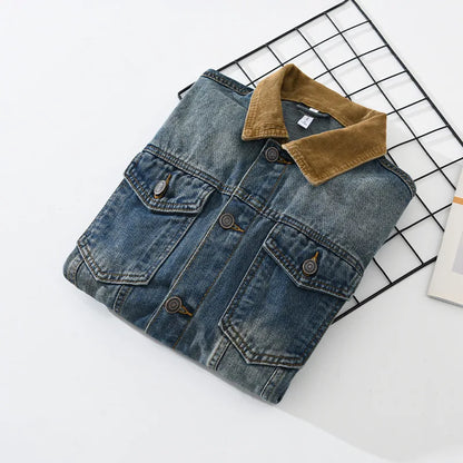 Denim jacket with brown corduroy collar on a grid background