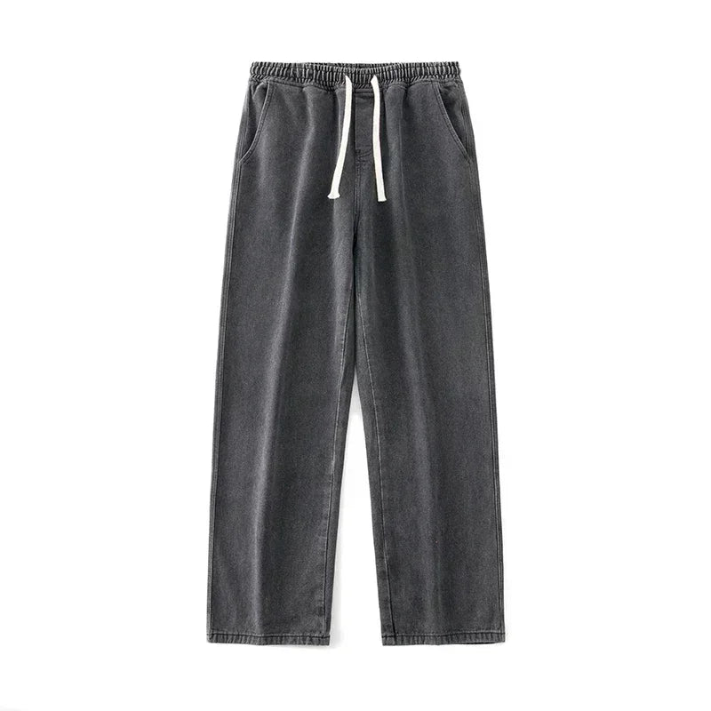 Gray sweatpants with a drawstring on a white background
