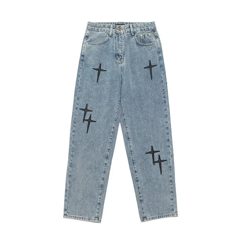 Light blue jeans with black star patterns on a white background