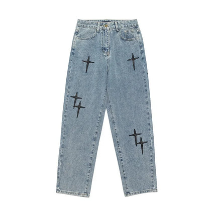 Light blue jeans with black star patterns on a white background