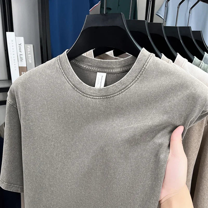 Gray t-shirt on a hanger with a blurred background