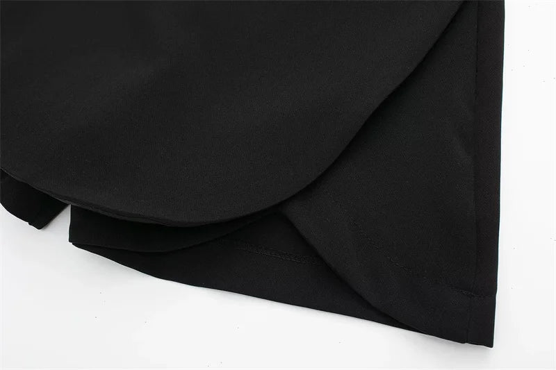 Black fabric with folds on a white background