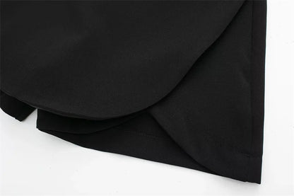 Black fabric with folds on a white background
