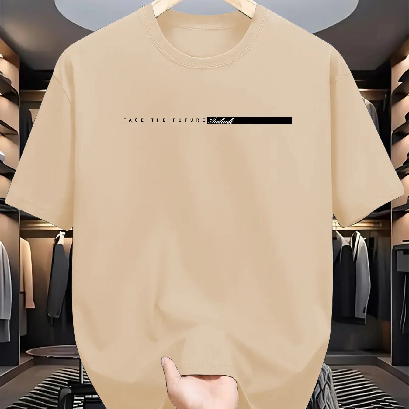 Beige t-shirt with text on a hanger in a clothing store.
