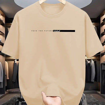 Beige t-shirt with text on a hanger in a clothing store.