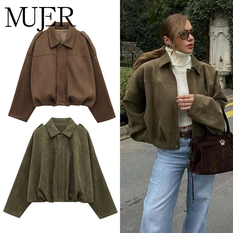 Brown and green jackets with a person wearing a brown jacket outdoors.