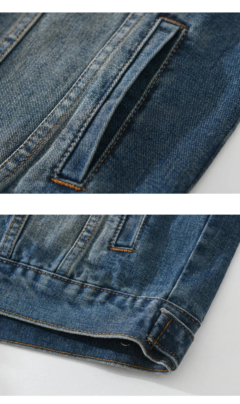 Close-up of a blue denim jacket with a pocket detail on a white background