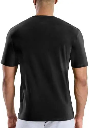 Black t-shirt worn by a person on a white background