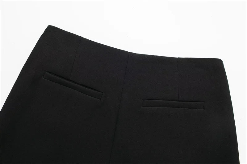 Close-up of black pants on a white background