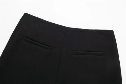 Close-up of black pants on a white background