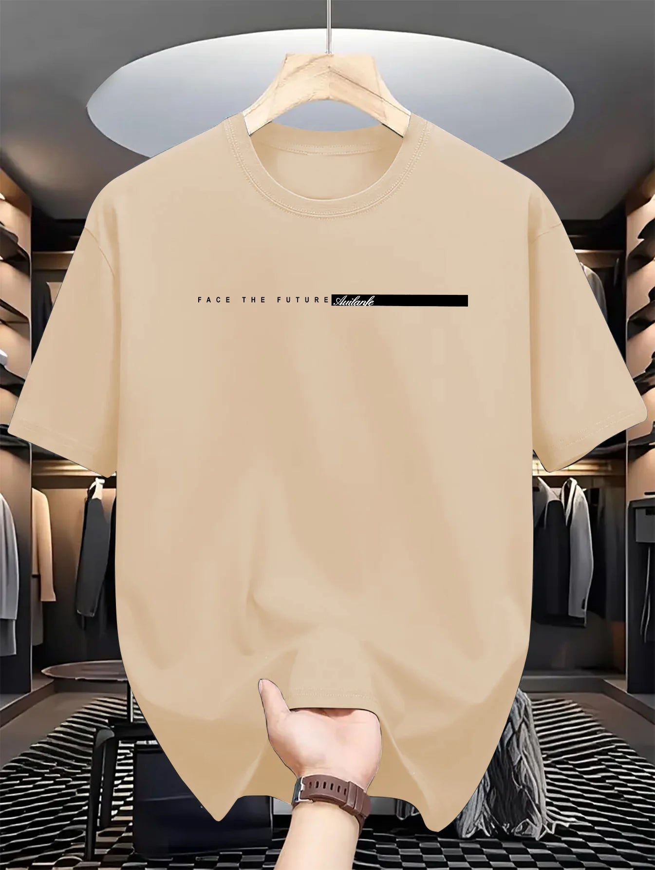 Beige t-shirt with text on a hanger in a clothing store.