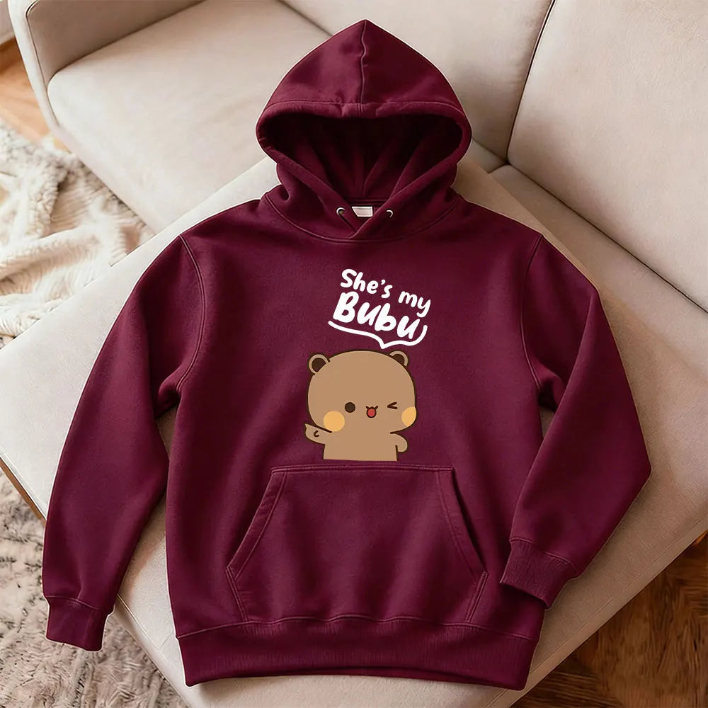 Maroon hoodie with bear graphic and text 'She's my Bubu' on a beige couch.