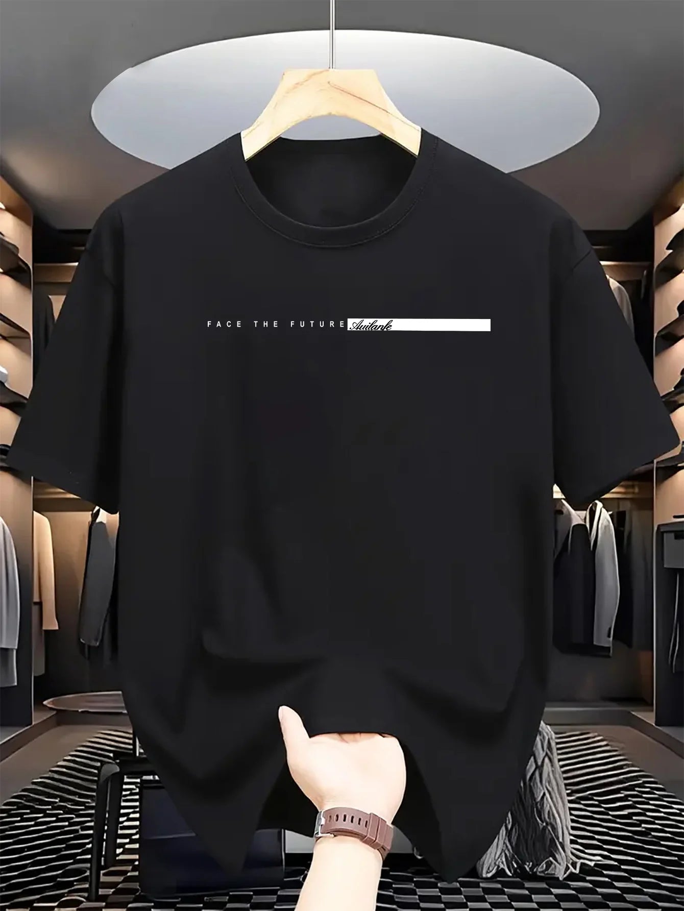Black t-shirt with text on a hanger in a clothing store.