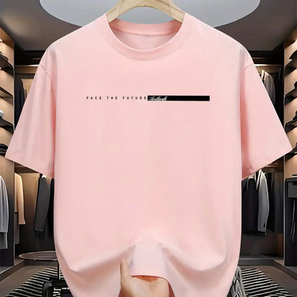 Pink t-shirt with text on a hanger in a clothing store.
