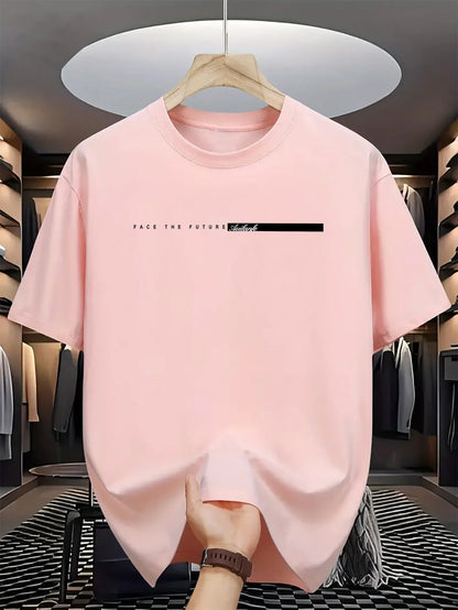 Pink t-shirt with text on a hanger in a clothing store.