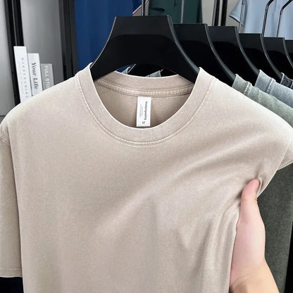 Beige t-shirt on a hanger with a blurred background