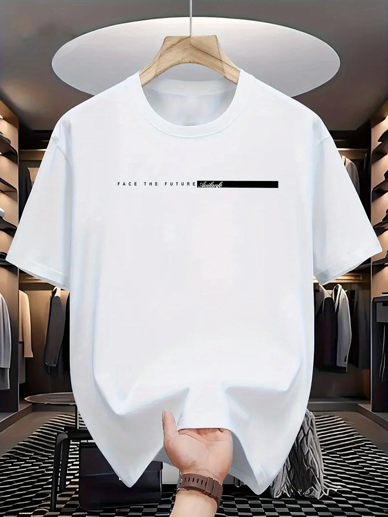White t-shirt with text on a hanger in a clothing store.