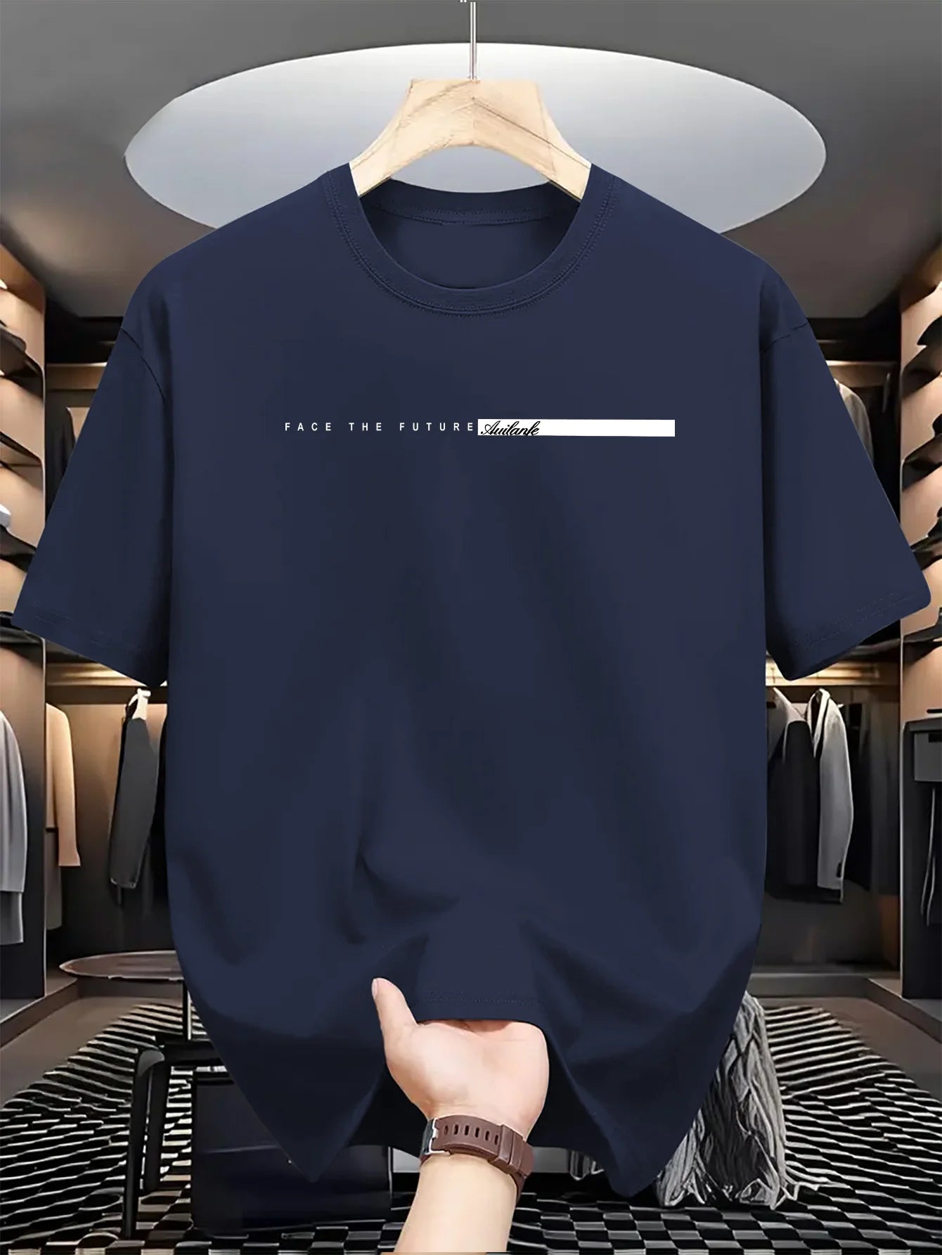 Navy blue t-shirt with text on a hanger in a clothing store.