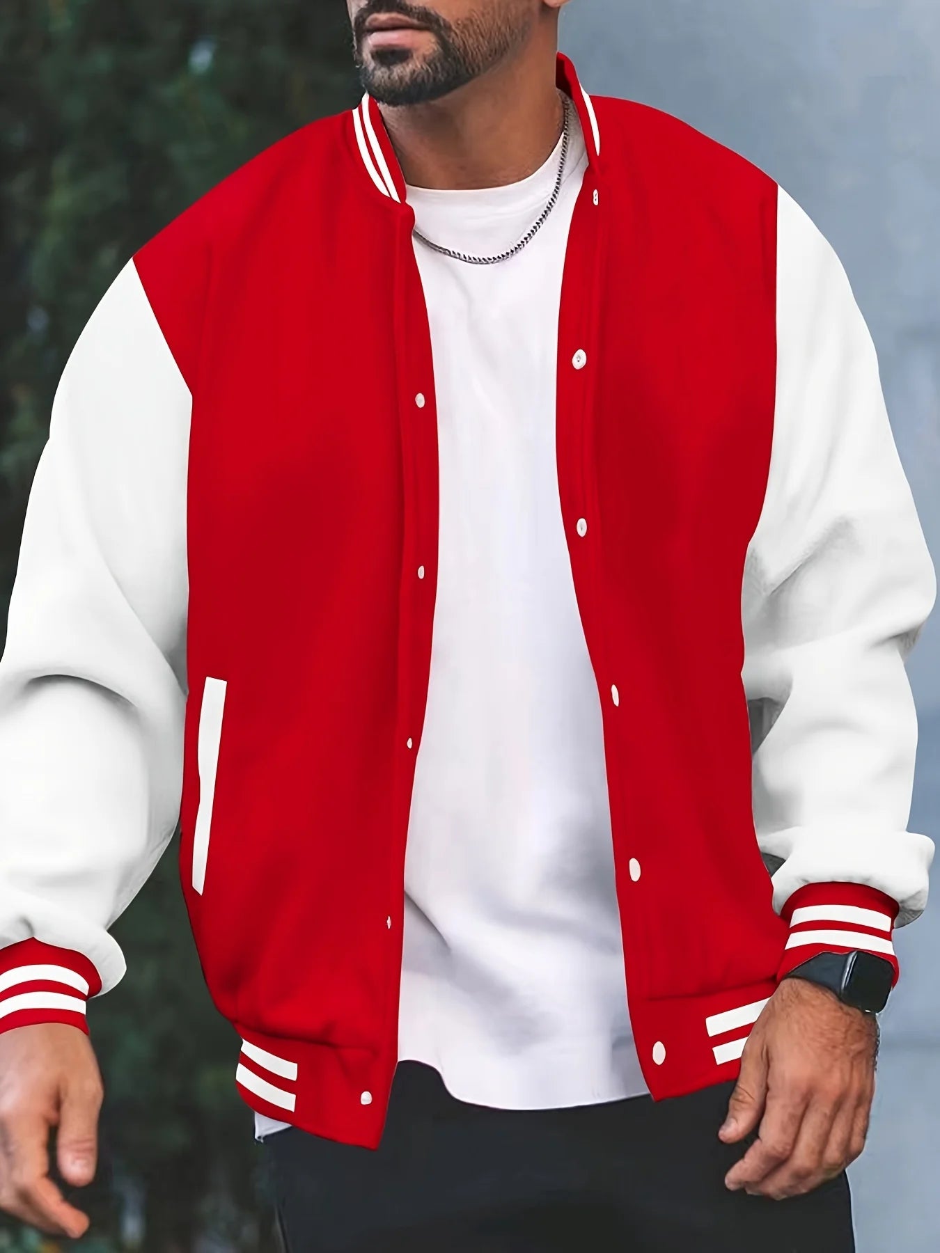 Red and white varsity jacket worn by a person with a blurred background