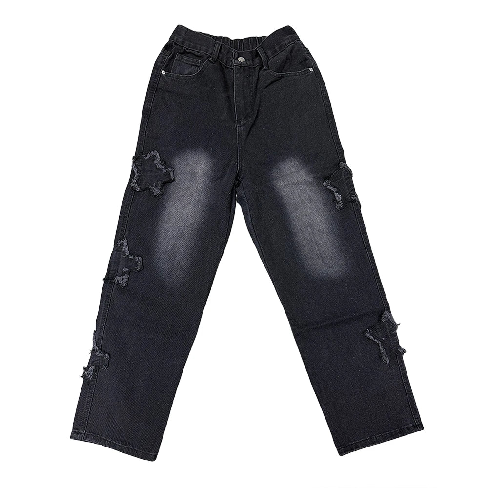 Black distressed jeans on a white background