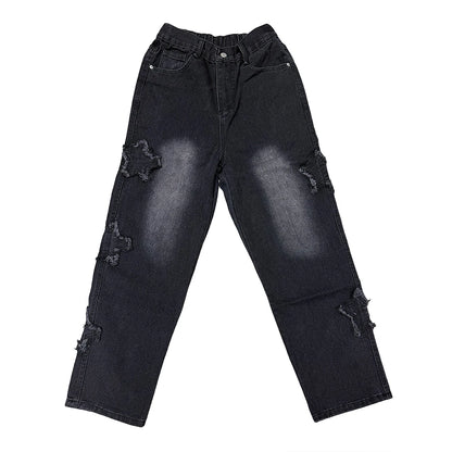 Black distressed jeans on a white background