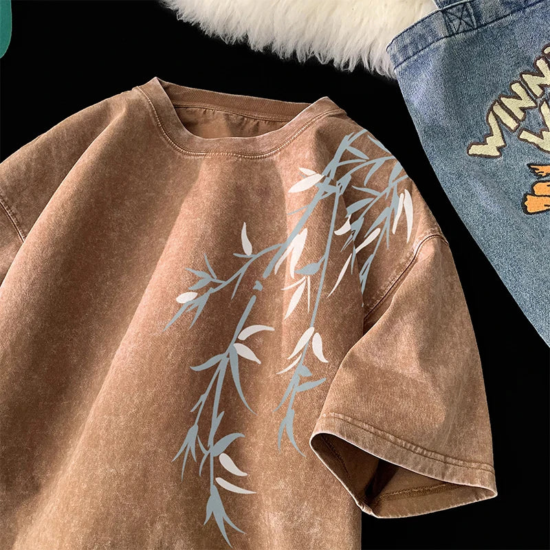 Brown sweatshirt with leaf pattern on a black background