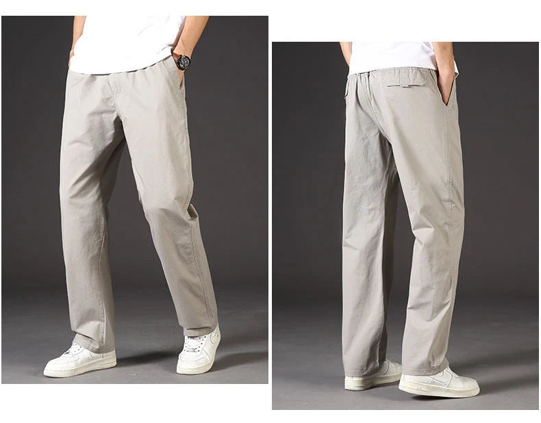 Light gray pants worn by a person on a dark background