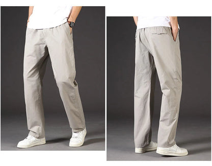 Light gray pants worn by a person on a dark background