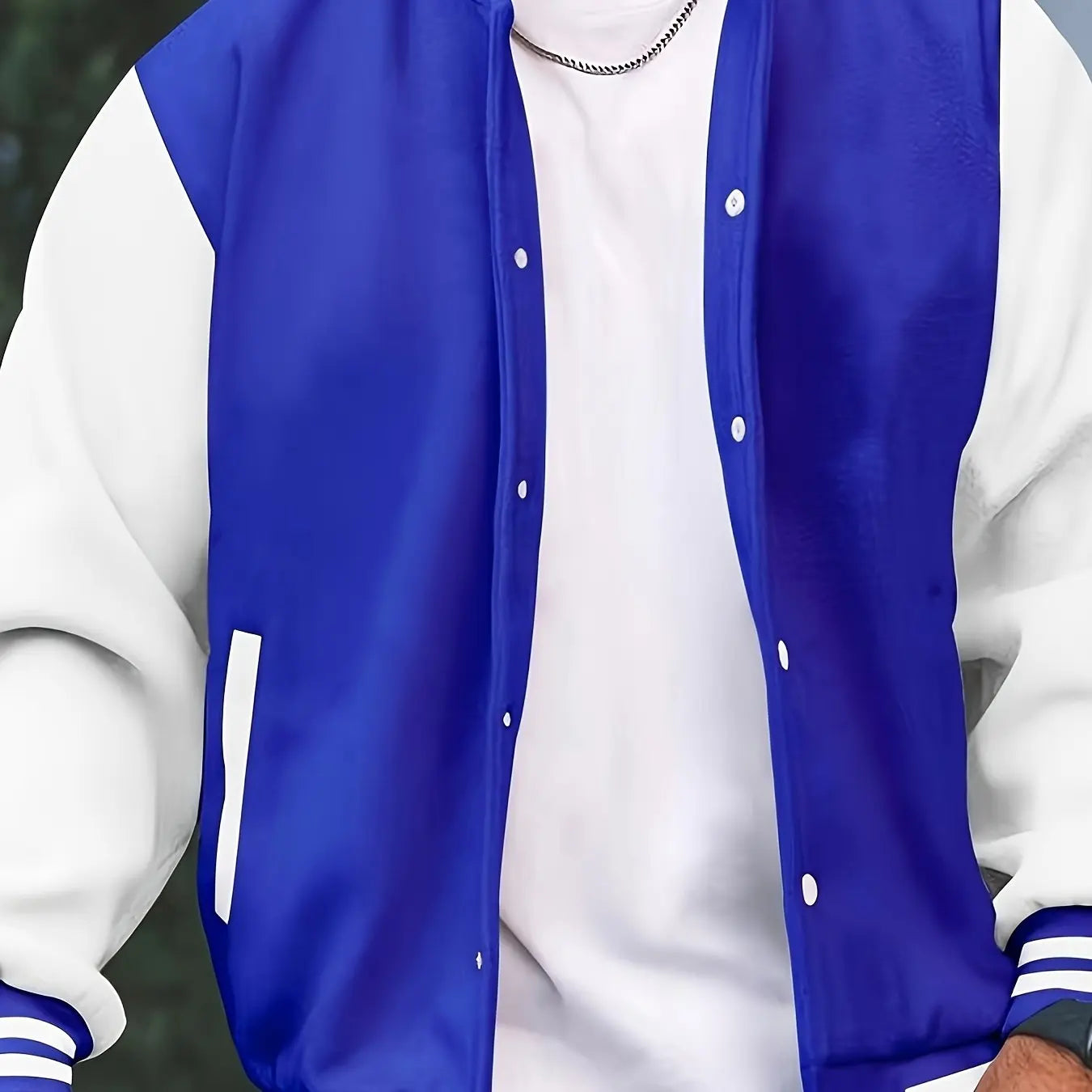 Blue and white varsity jacket worn by a person