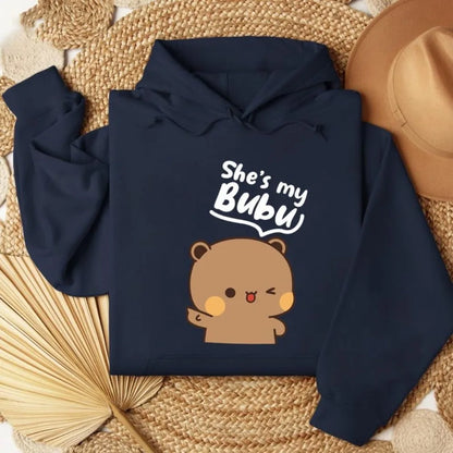 Navy blue hoodie with bear graphic and 'She's my Bubu' text on a woven surface.