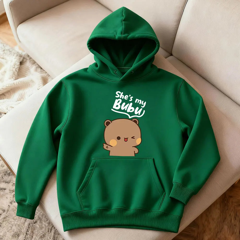 Green hoodie with bear graphic and text on a chair