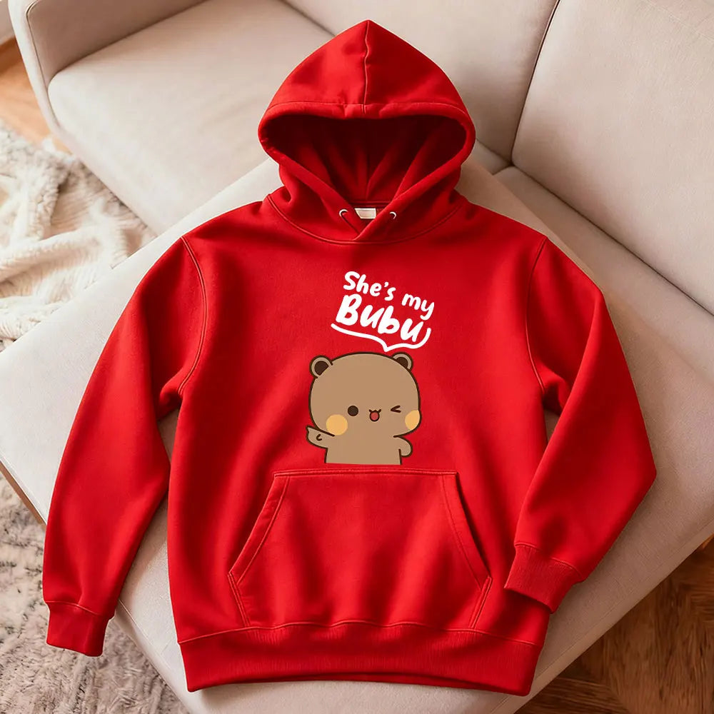 Red hoodie with bear graphic and text 'She's my Bubu' on a beige couch.