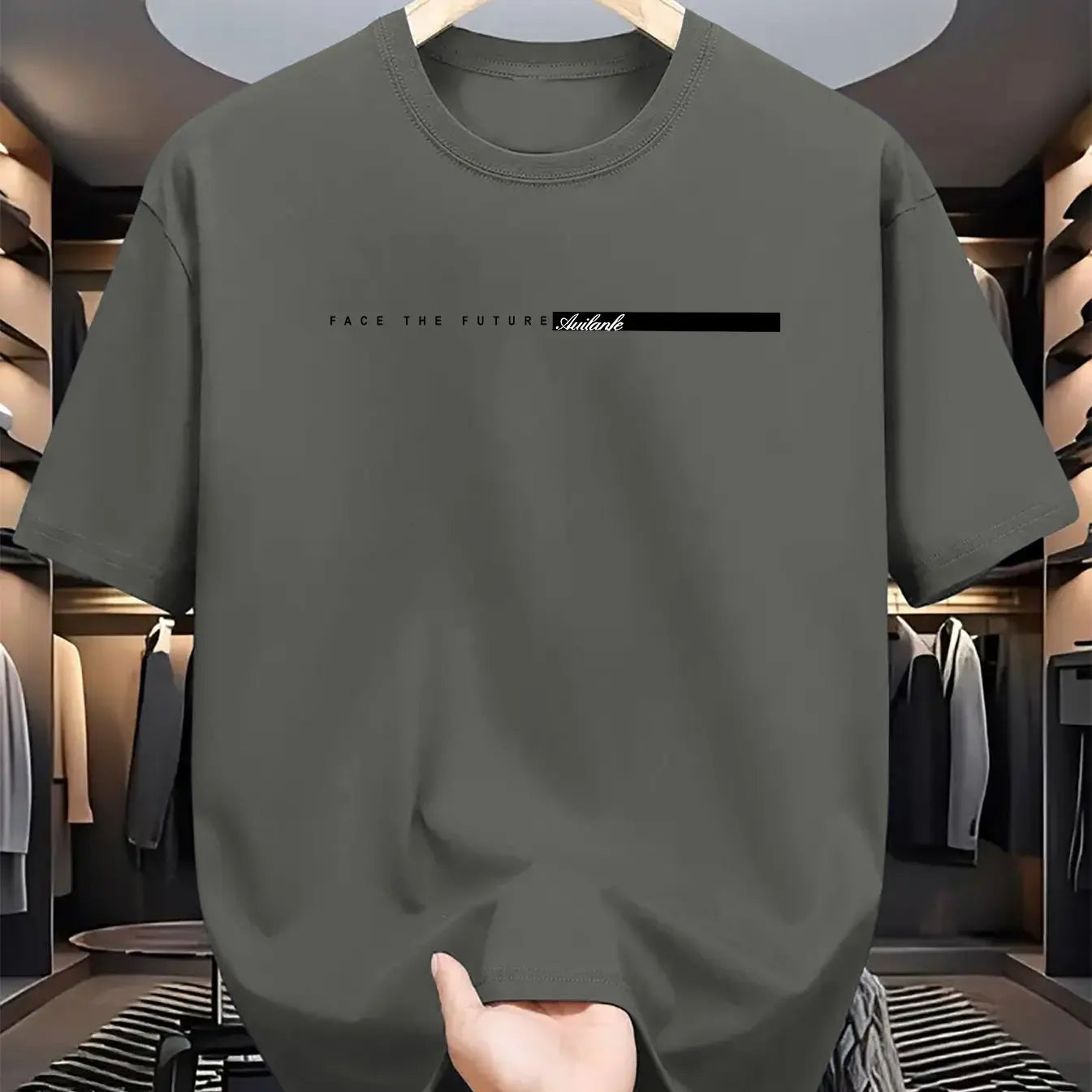 Gray t-shirt with text held in a clothing store.